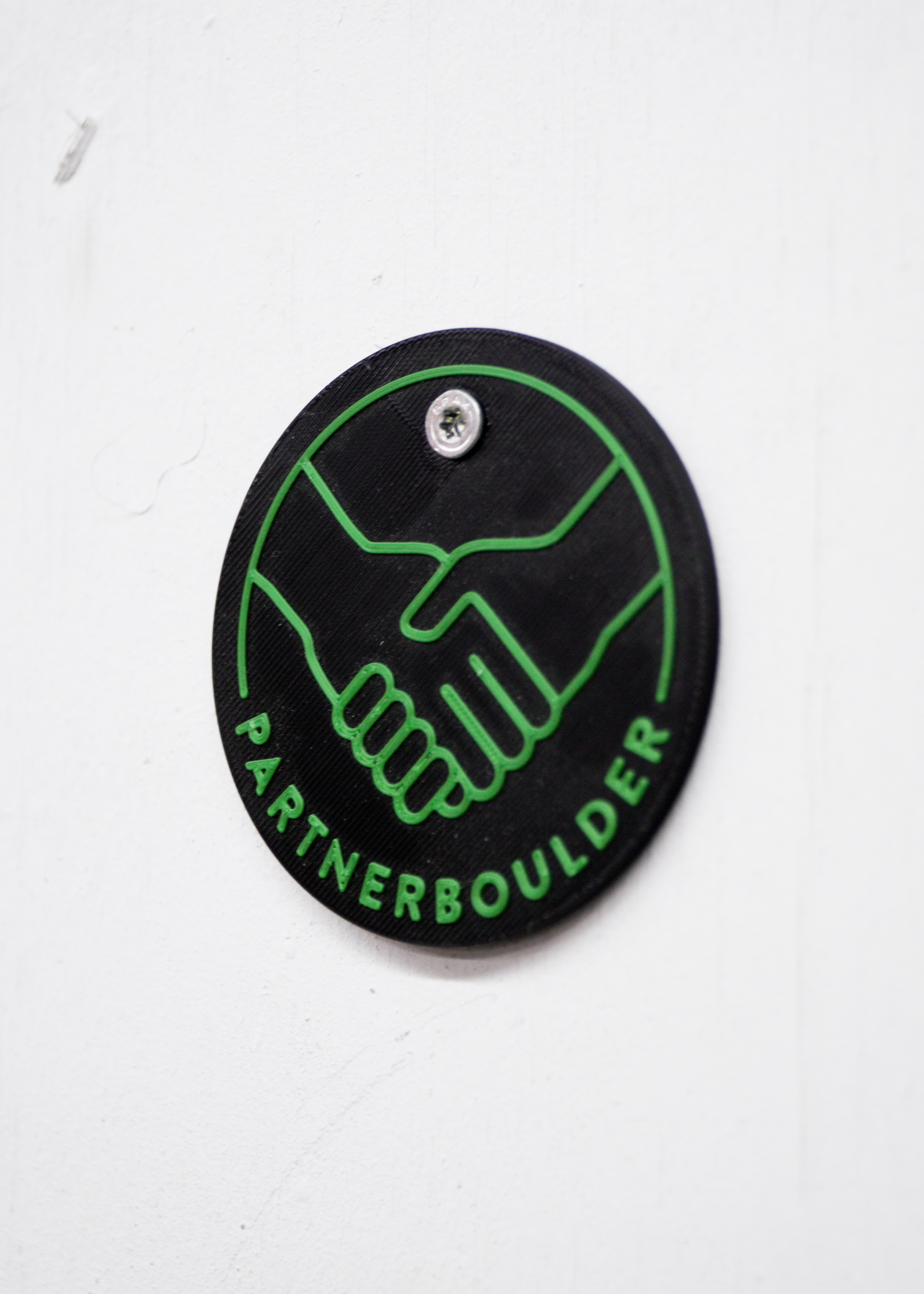 Spezial-Tag Partnerboulder mit Handschlag-Symbol